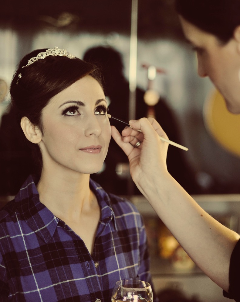 Charlotte bridal makeup artist Giulia applying makeup to a bride
